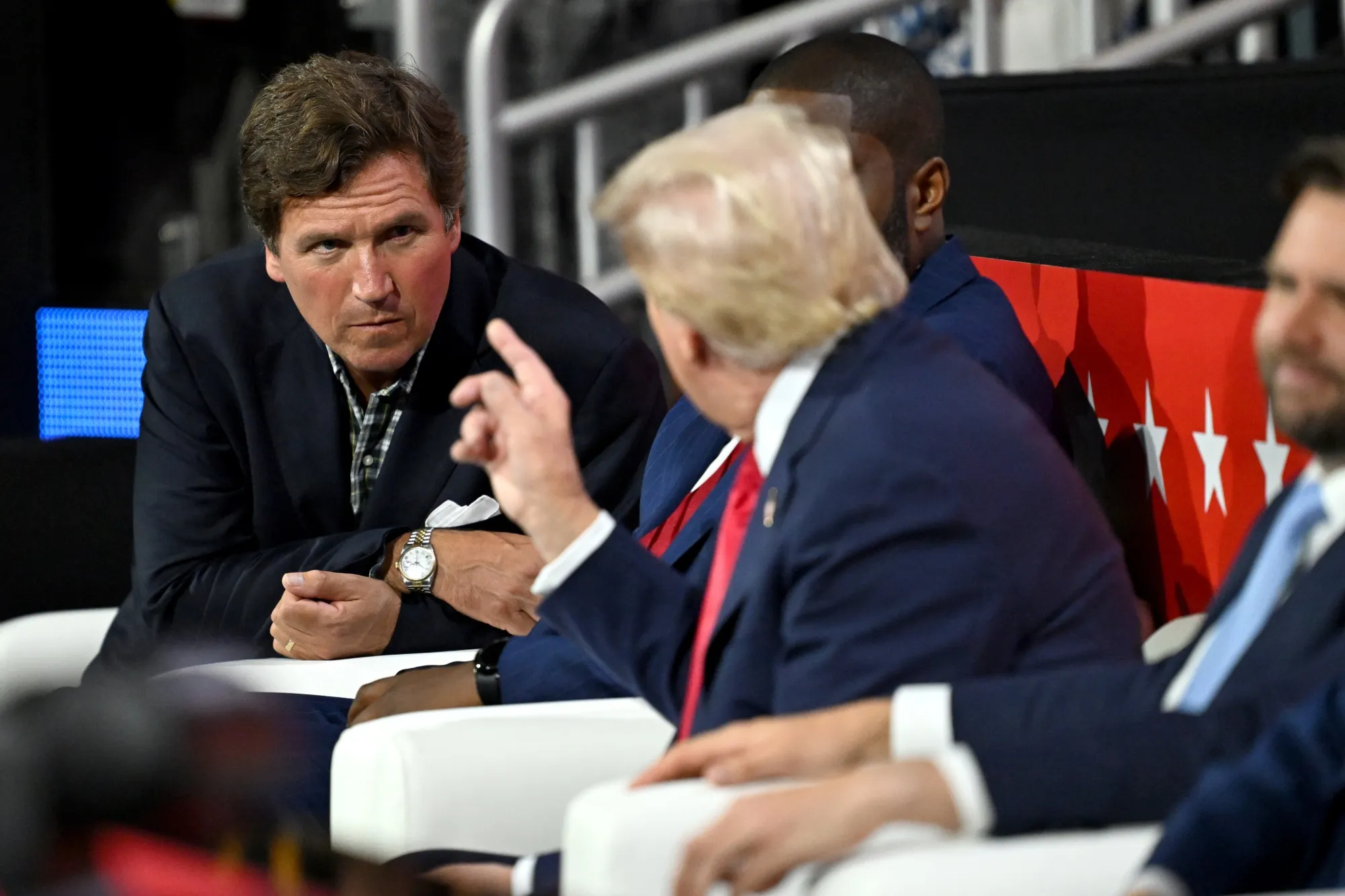 Tucker Carlson y Trump en un evento
