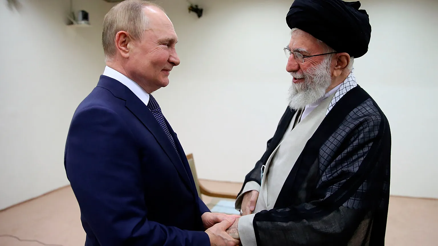 Vladimir Putin and Ali Khamenei.