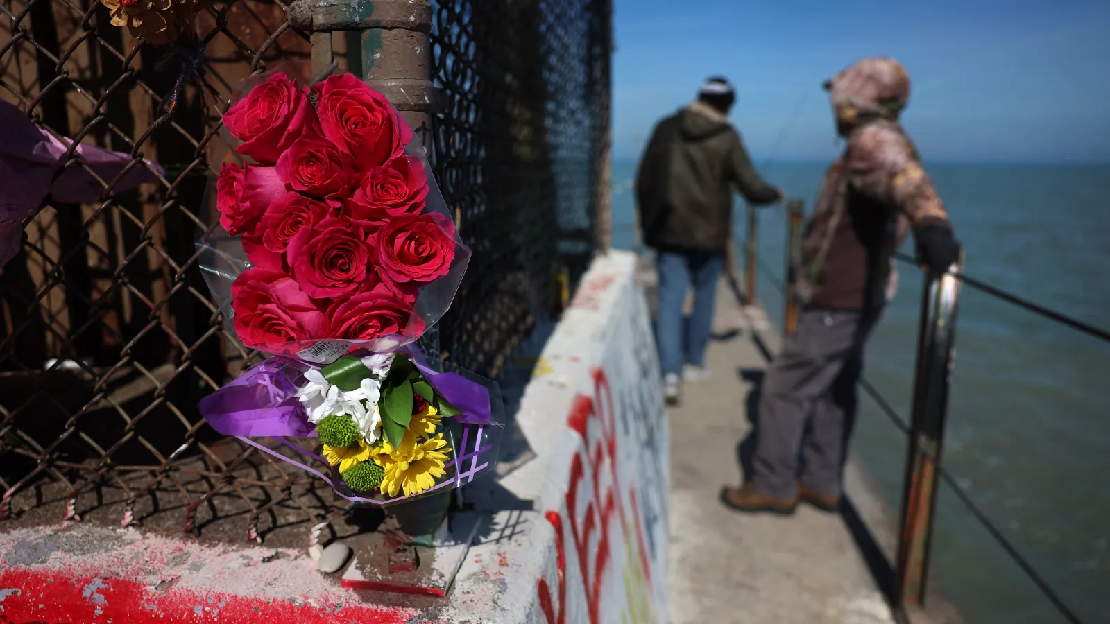 Flowers are seen on the pier at Tobey Prinz Beach in Chicago in memory of the murdered student.