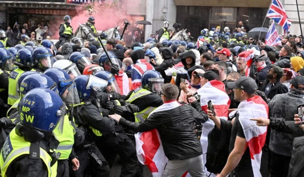 English police suppressing a protest against illegal immigration