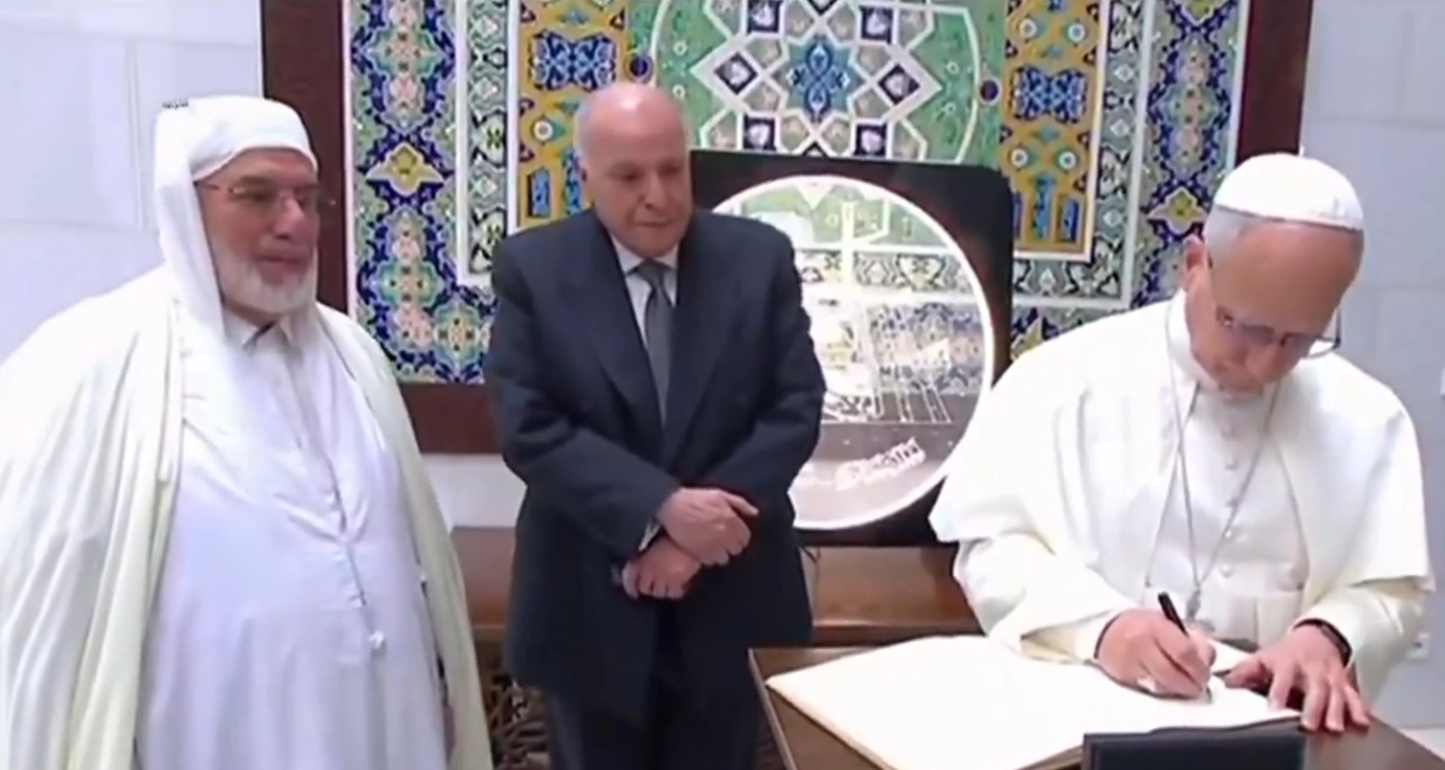 Pope Leo XIV signing the book of honor of the Great Mosque of Algiers