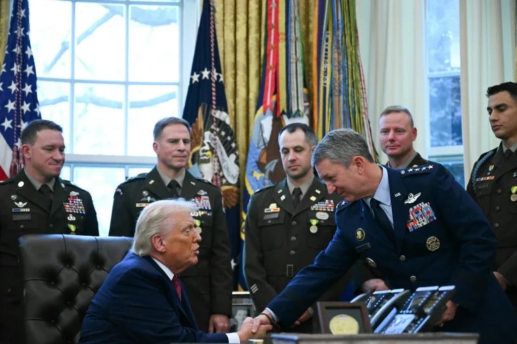 Donald Trump alongside Dan Caine