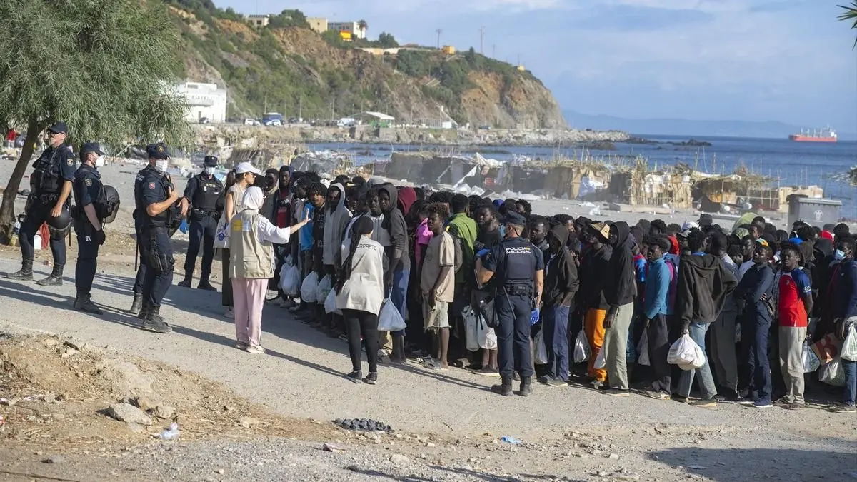 Police in Ceuta with illegal immigrants