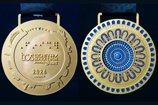 The front and back of the Sydney Marathon 2026 medal