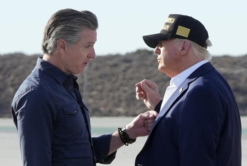 Newsom alongside Trump, in last year's Palisades fires.