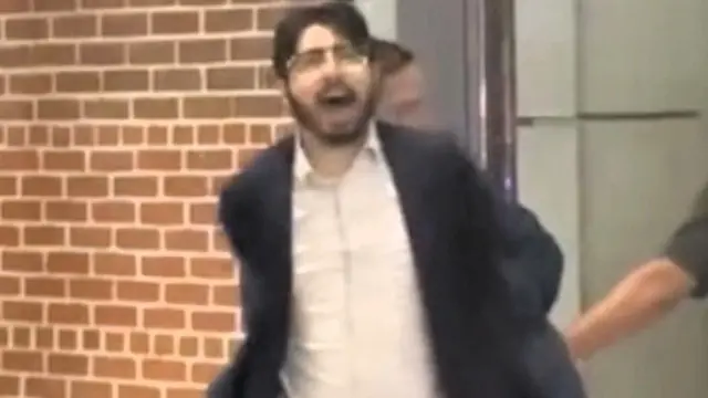 Elias Rodriguez being arrested.