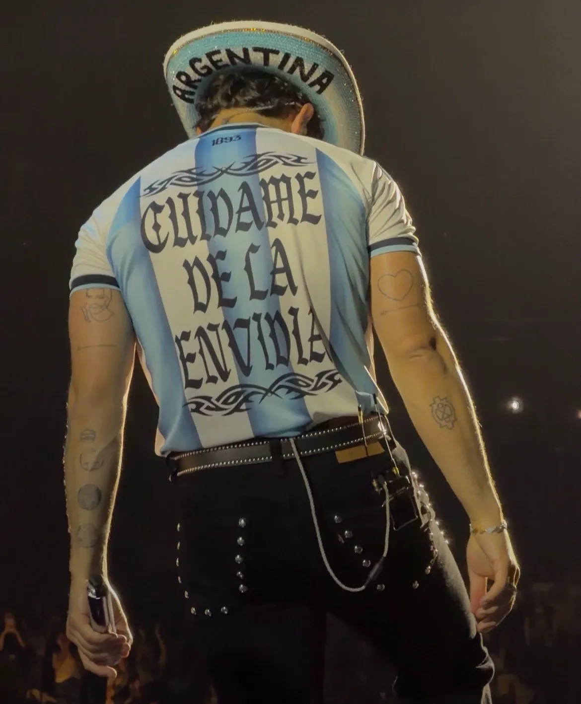 Joe Jonas in a light blue shirt