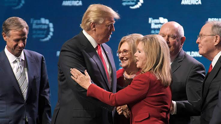 Blackburn alongside Trump