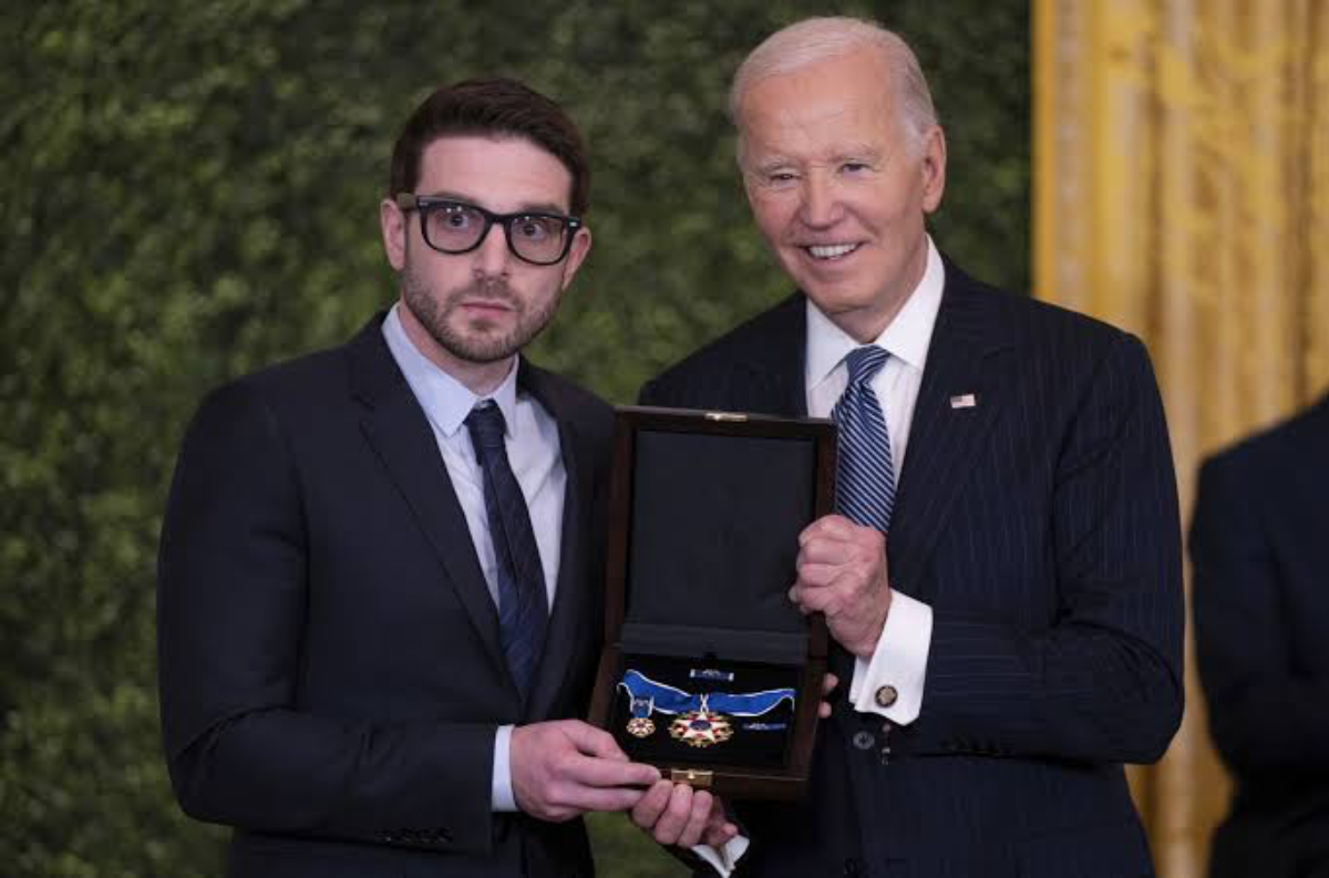 Former President Joe Biden awarding Soros' son.