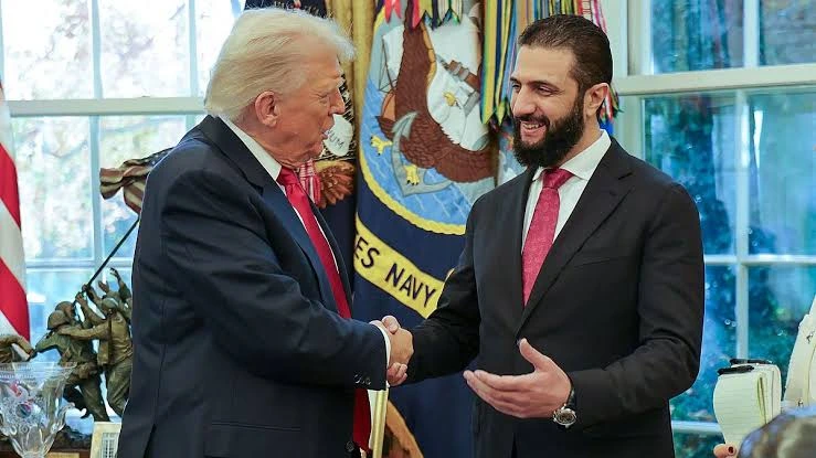 Donald Trump alongside Ahmed al Sharaa