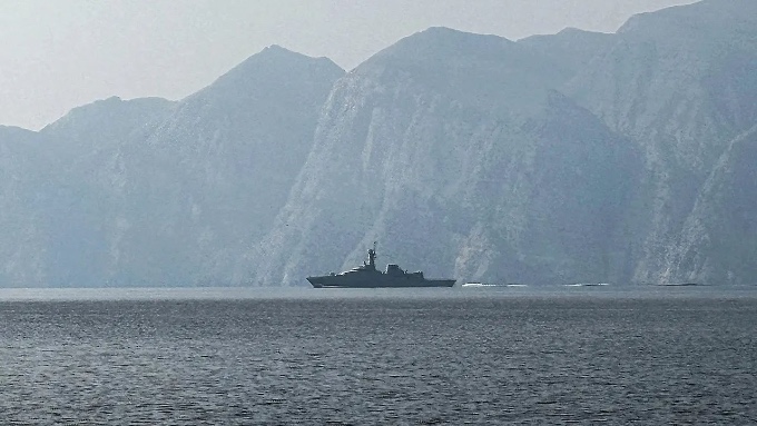The tankers navigate through the strait with U.S. protection